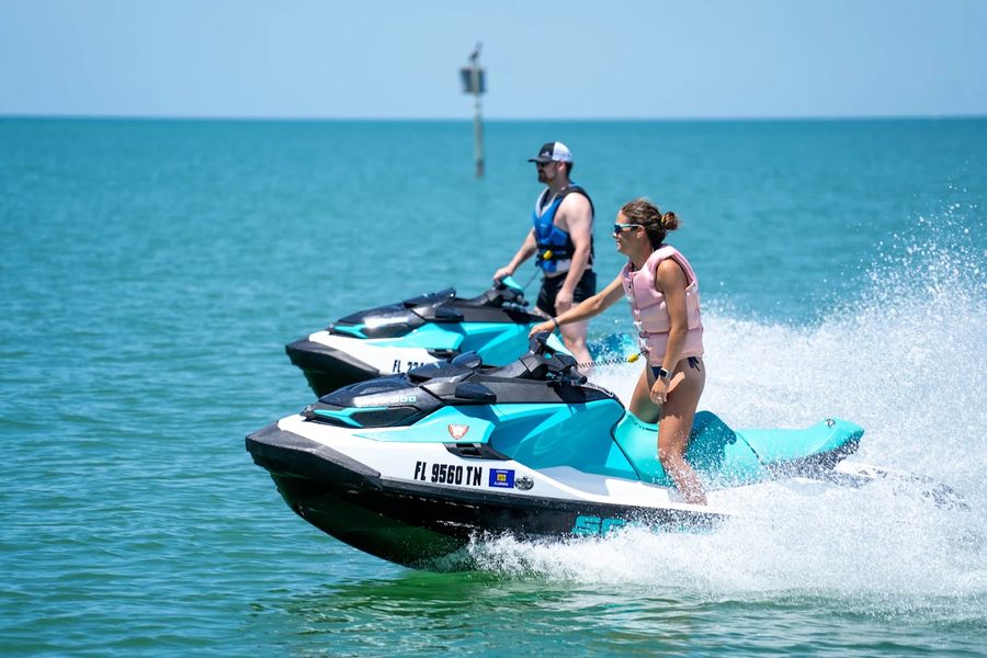 Two Sea-Doo GTX PWCs in formation on the Gulf of America